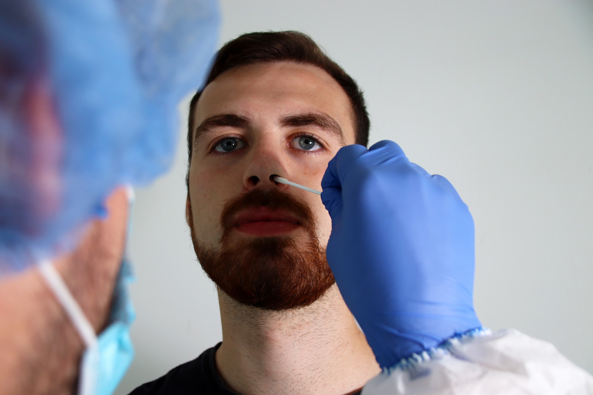 man taking a PCR test